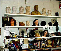 Busts on a wall in the studio